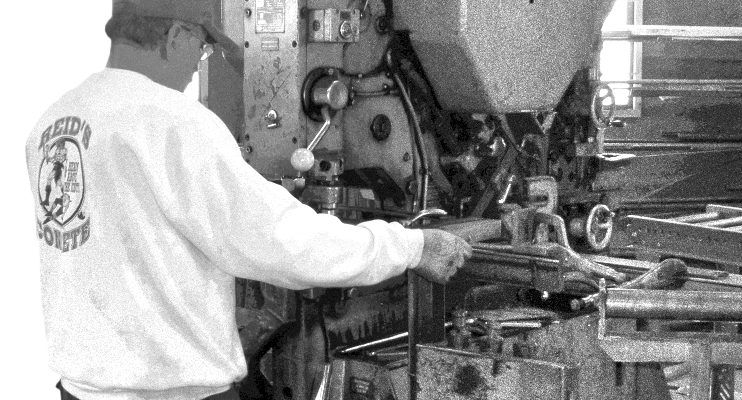 iron-worker working with equipment