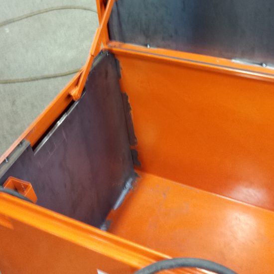 Welder repairing a toolbox.
